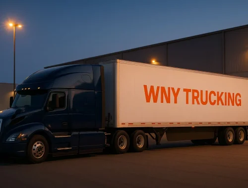 Two WNY Trucking semi trucks in a well-lit logistics yard at dusk, symbolizing reliable, efficient, and trusted freight services.